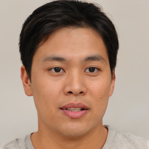 Neutral asian young-adult male with short  brown hair and brown eyes