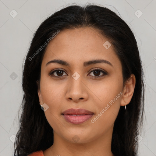 Joyful latino young-adult female with long  brown hair and brown eyes