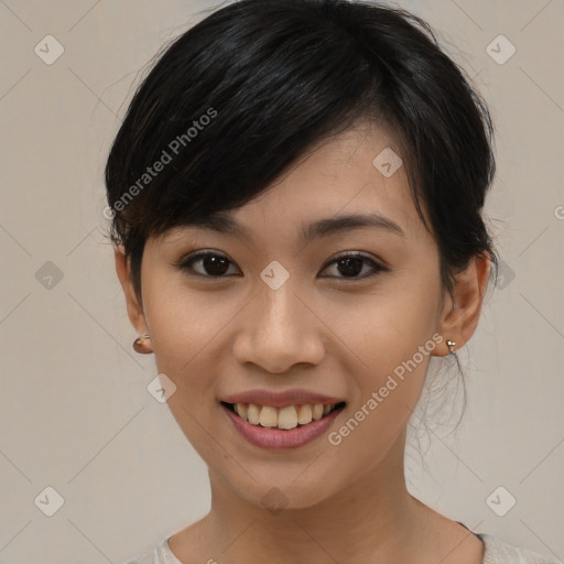 Joyful asian young-adult female with medium  black hair and brown eyes