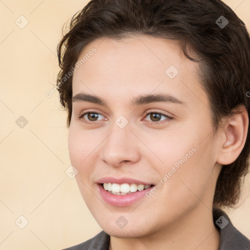 Joyful white young-adult female with short  brown hair and brown eyes