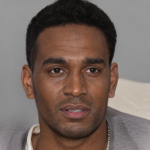 Neutral black young-adult male with short  brown hair and brown eyes