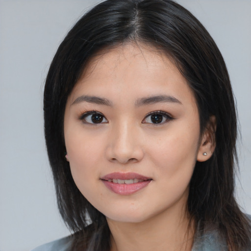 Joyful asian young-adult female with medium  black hair and brown eyes