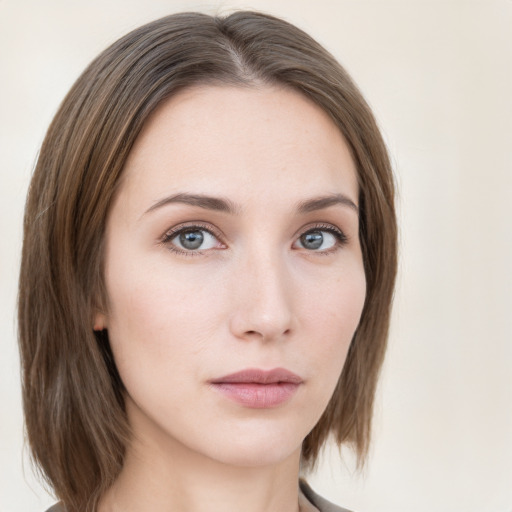 Neutral white young-adult female with medium  brown hair and grey eyes