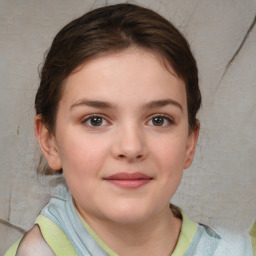 Joyful white child female with short  brown hair and brown eyes