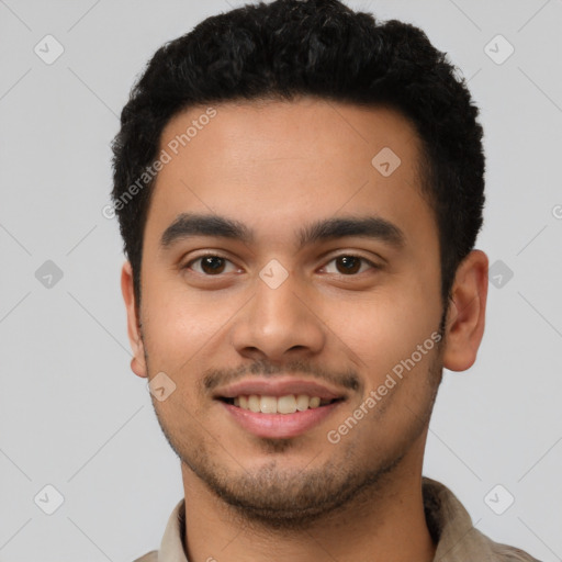 Joyful latino young-adult male with short  black hair and brown eyes