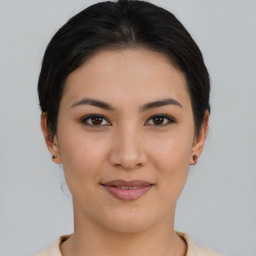 Joyful asian young-adult female with short  brown hair and brown eyes