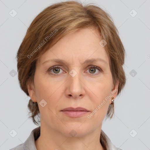 Joyful white adult female with medium  brown hair and grey eyes