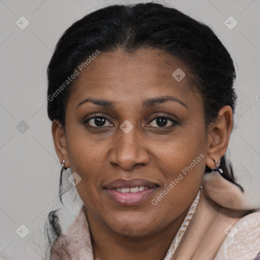Joyful black adult female with short  brown hair and brown eyes