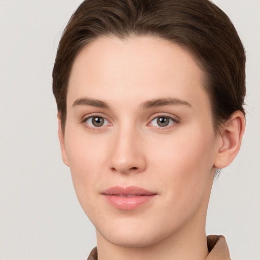 Neutral white young-adult female with short  brown hair and brown eyes