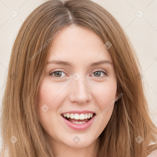 Joyful white young-adult female with long  brown hair and green eyes