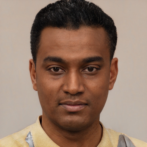 Neutral latino young-adult male with short  black hair and brown eyes