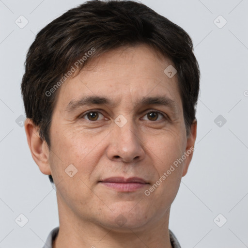 Joyful white adult male with short  brown hair and brown eyes