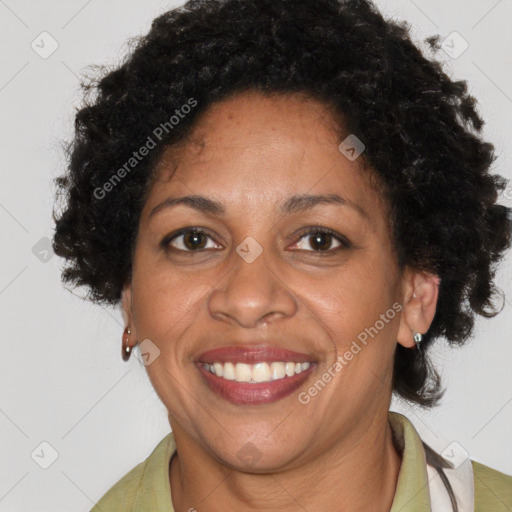 Joyful black adult female with short  brown hair and brown eyes