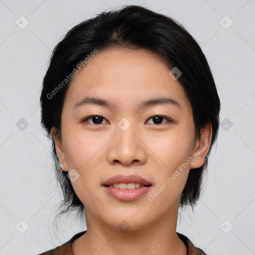 Joyful asian young-adult female with medium  black hair and brown eyes