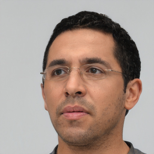 Neutral white adult male with short  black hair and brown eyes