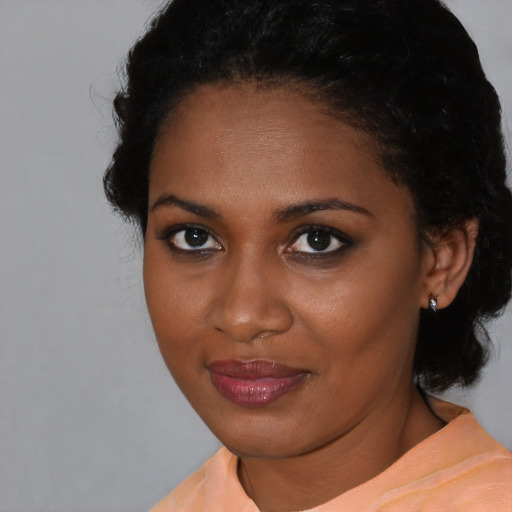 Neutral black young-adult female with medium  black hair and brown eyes