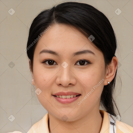 Joyful asian young-adult female with medium  brown hair and brown eyes