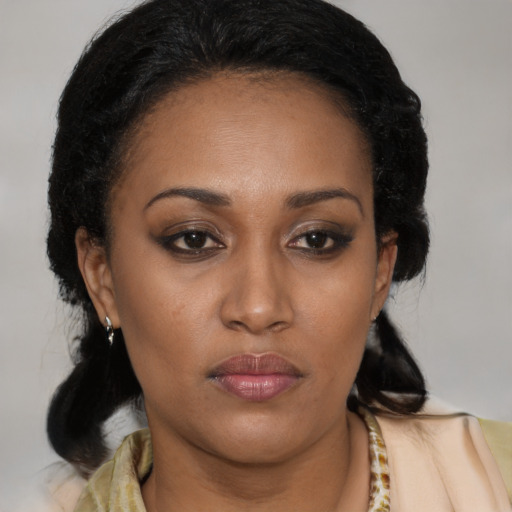 Neutral black young-adult female with medium  brown hair and brown eyes
