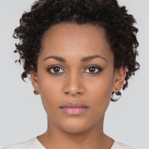 Neutral black young-adult female with short  brown hair and brown eyes