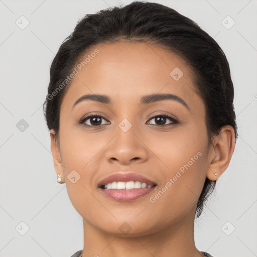 Joyful latino young-adult female with short  brown hair and brown eyes