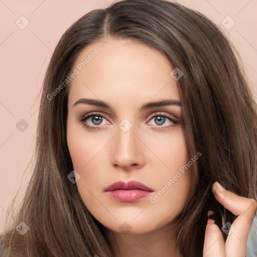 Neutral white young-adult female with long  brown hair and brown eyes