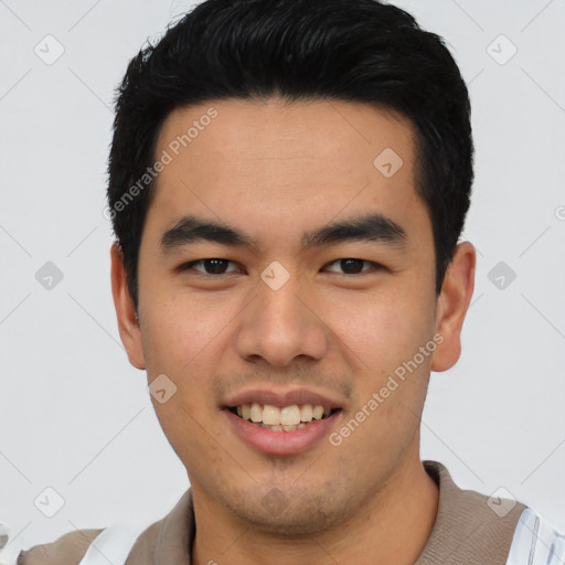 Joyful asian young-adult male with short  black hair and brown eyes