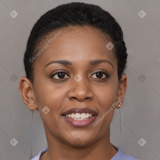 Joyful black young-adult female with short  brown hair and brown eyes