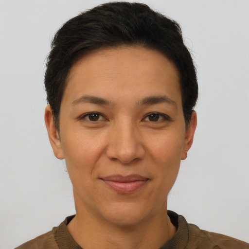Joyful latino adult female with short  brown hair and brown eyes