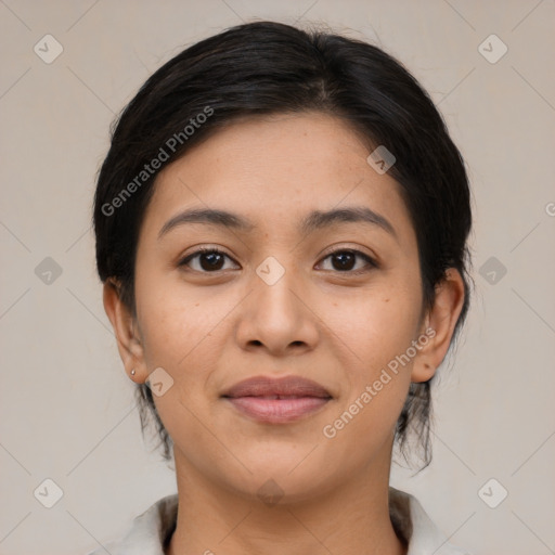 Joyful latino young-adult female with medium  brown hair and brown eyes