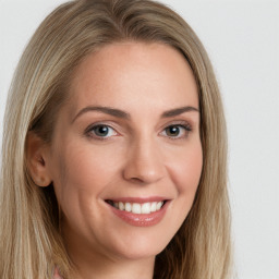 Joyful white young-adult female with long  brown hair and green eyes