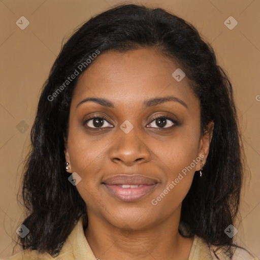 Joyful black young-adult female with long  brown hair and brown eyes
