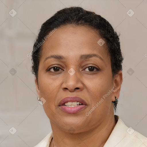 Joyful black adult female with short  brown hair and brown eyes