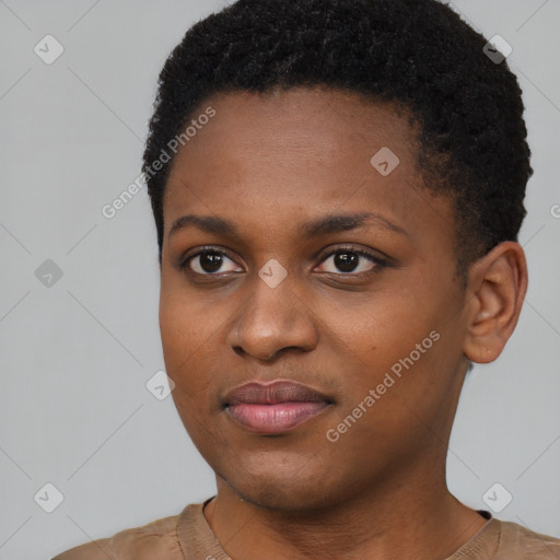 Joyful black young-adult female with short  black hair and brown eyes