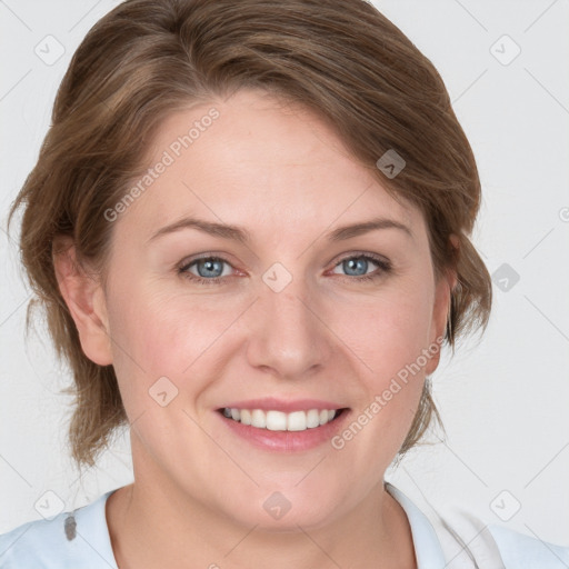 Joyful white young-adult female with medium  brown hair and blue eyes