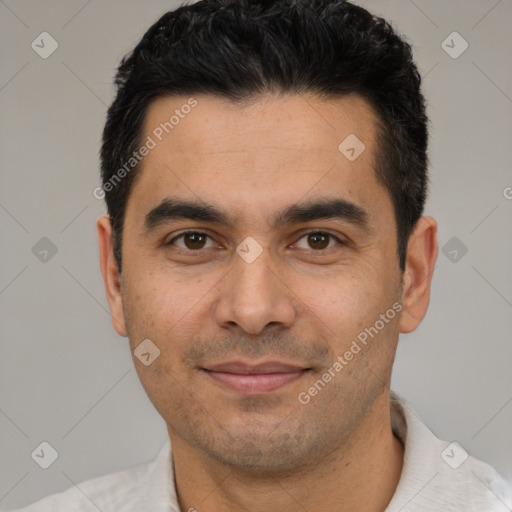 Joyful white young-adult male with short  black hair and brown eyes