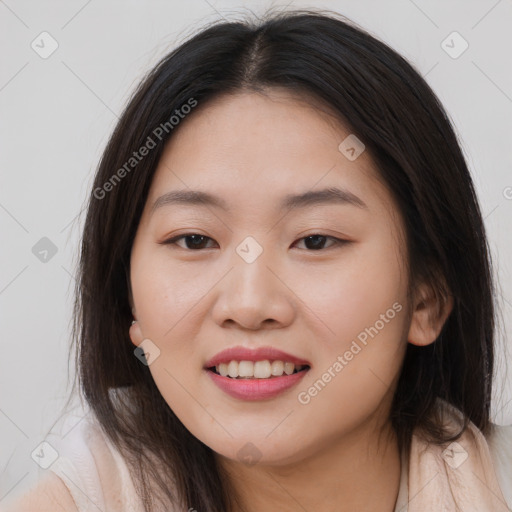 Joyful asian young-adult female with long  brown hair and brown eyes