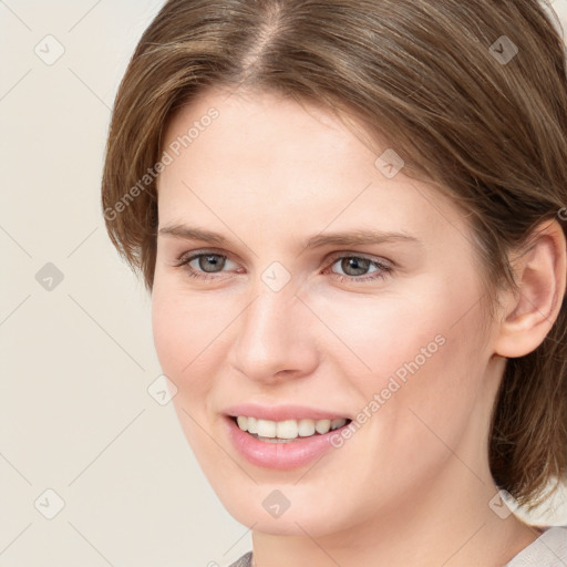 Joyful white young-adult female with medium  brown hair and blue eyes