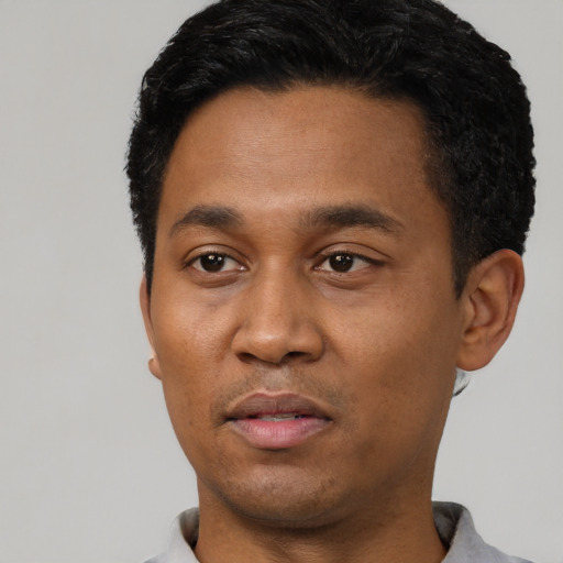 Neutral latino young-adult male with short  black hair and brown eyes
