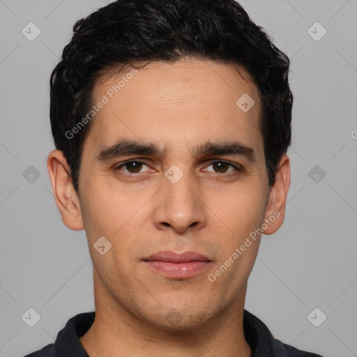 Joyful white young-adult male with short  black hair and brown eyes