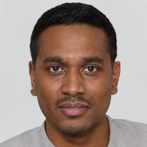 Neutral black young-adult male with short  black hair and brown eyes