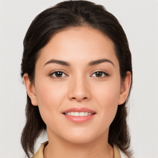 Joyful white young-adult female with medium  brown hair and brown eyes