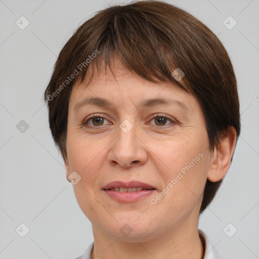 Joyful white adult female with short  brown hair and brown eyes