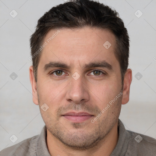 Joyful white adult male with short  brown hair and brown eyes