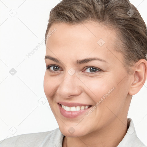 Joyful white young-adult female with short  brown hair and brown eyes