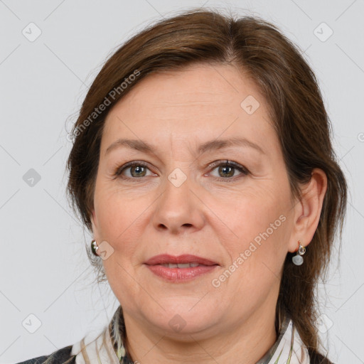 Joyful white adult female with medium  brown hair and brown eyes