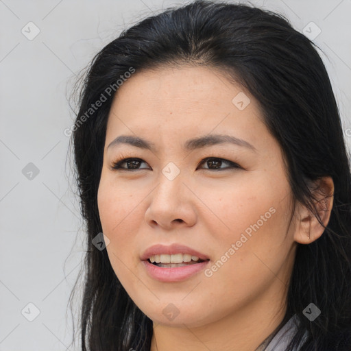 Joyful asian young-adult female with long  brown hair and brown eyes