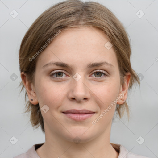 Joyful white young-adult female with medium  brown hair and grey eyes