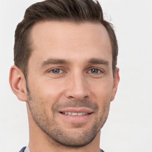 Joyful white young-adult male with short  brown hair and brown eyes