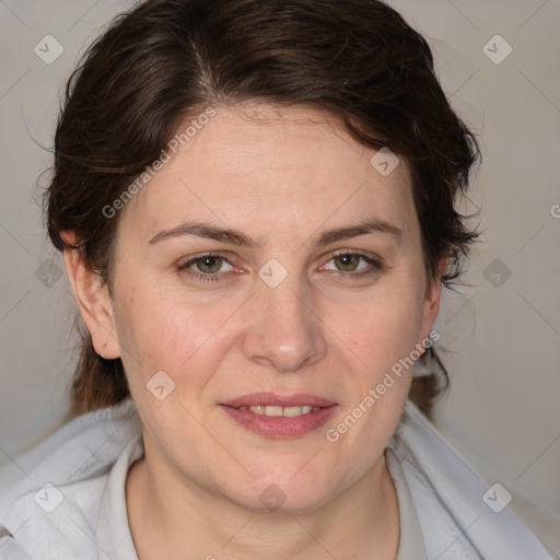 Joyful white adult female with medium  brown hair and blue eyes