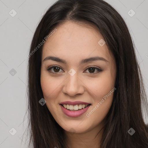 Joyful asian young-adult female with long  brown hair and brown eyes